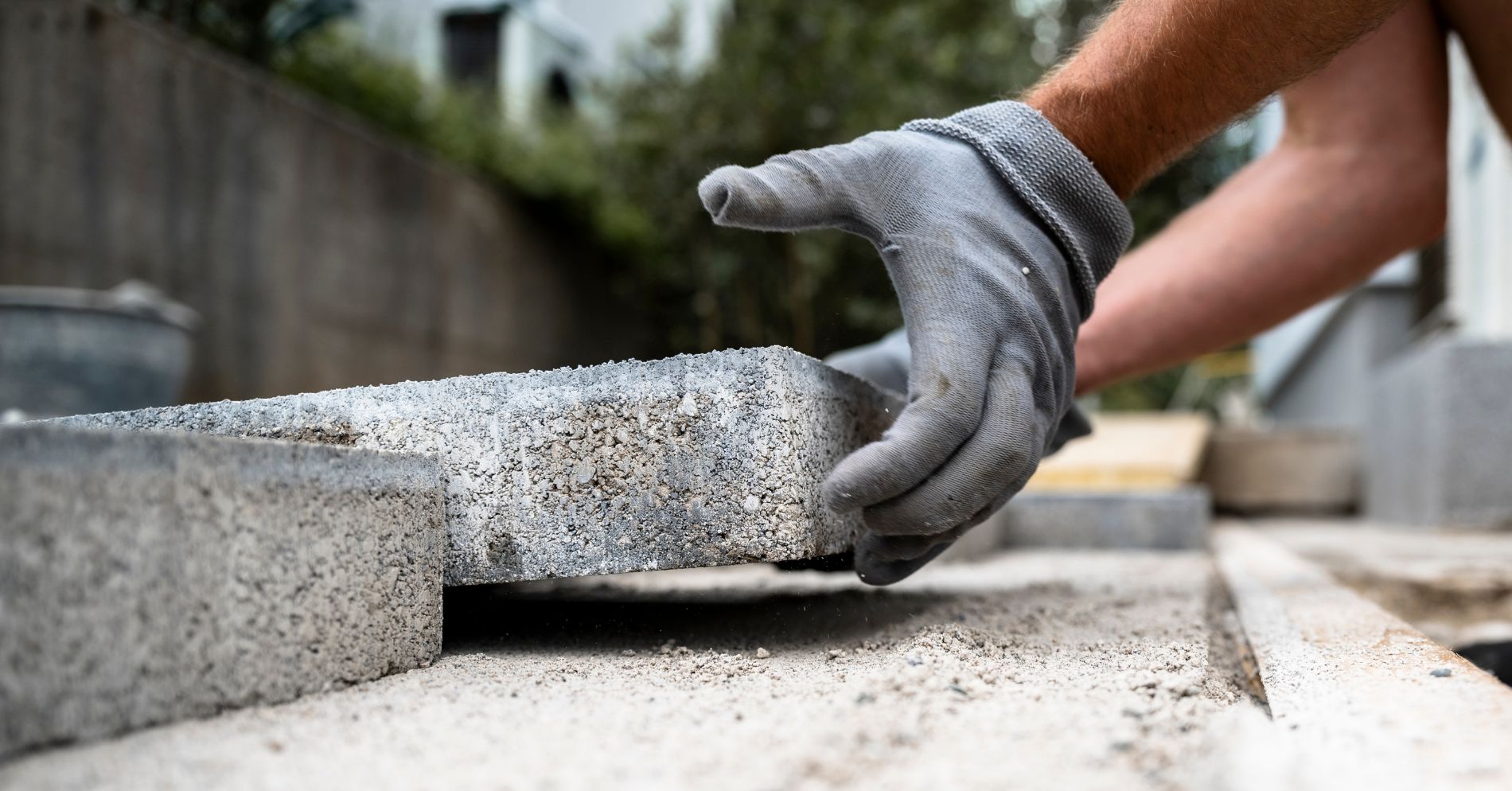 Untitled design (28) Man installing pavers